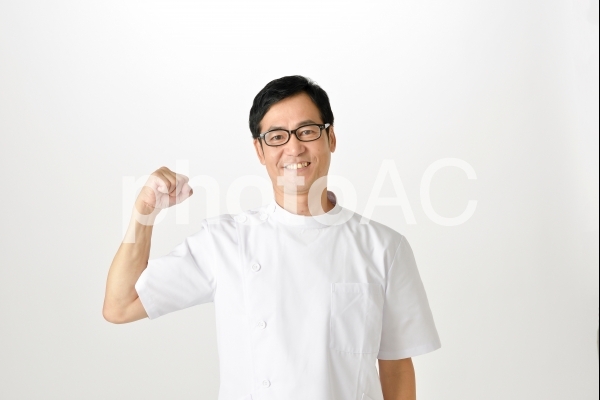 ガッツポーズをする整体師3 ガッツポーズをする整体師3の写真