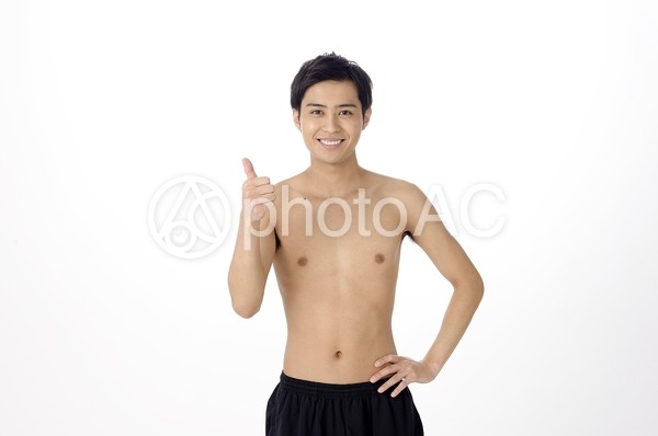 ハンドサインする上半身裸の男性1 ハンドサインする上半身裸の男性1の写真