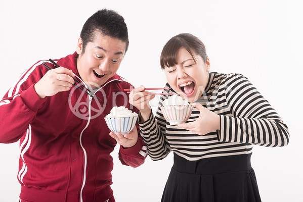 ご飯を食べる男女1 ご飯を食べる男女1の写真